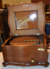 an image of 15.5 inch Regina Reginaphone music box - short bedplate - oak